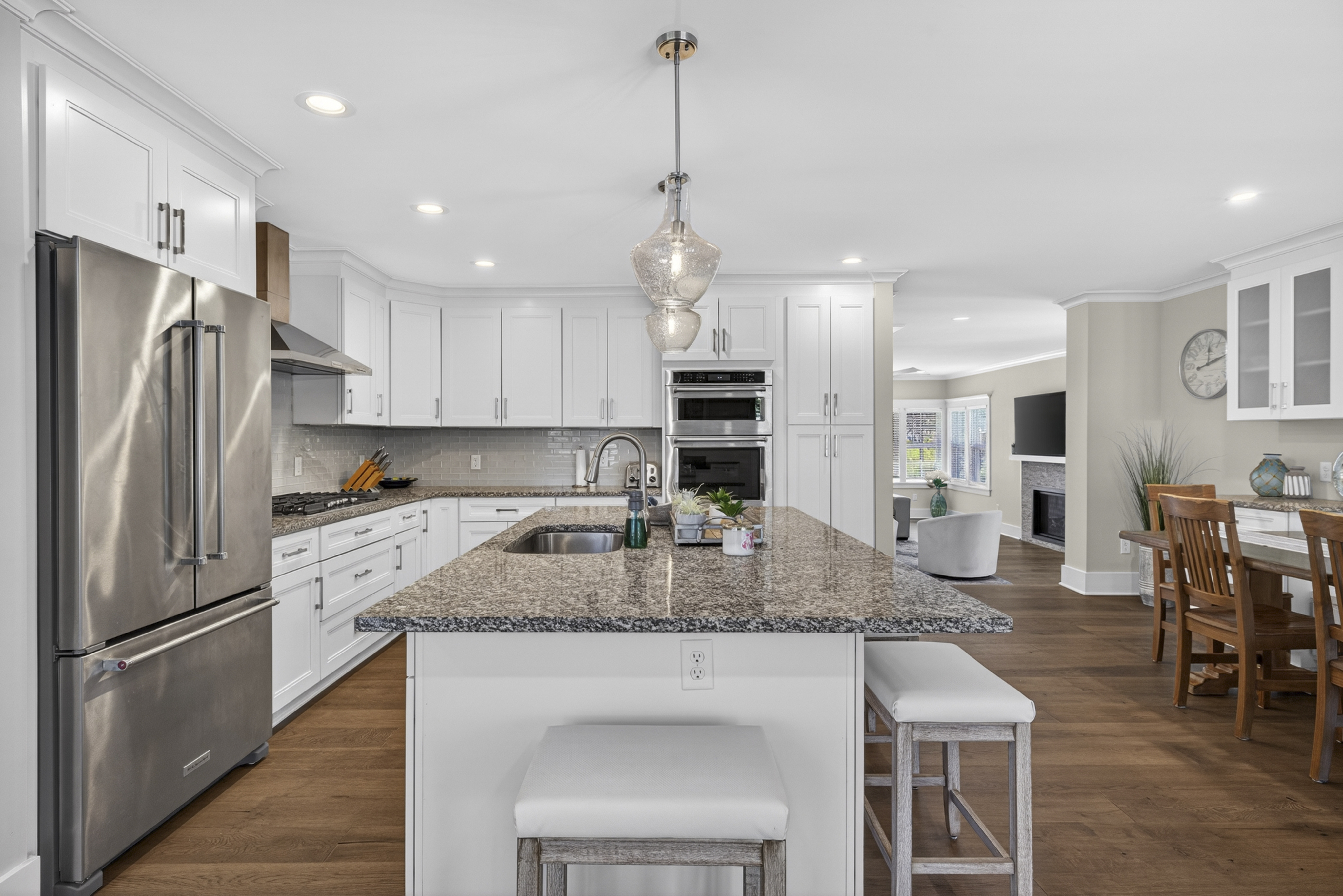 Kitchen with granite island and stainless appliances