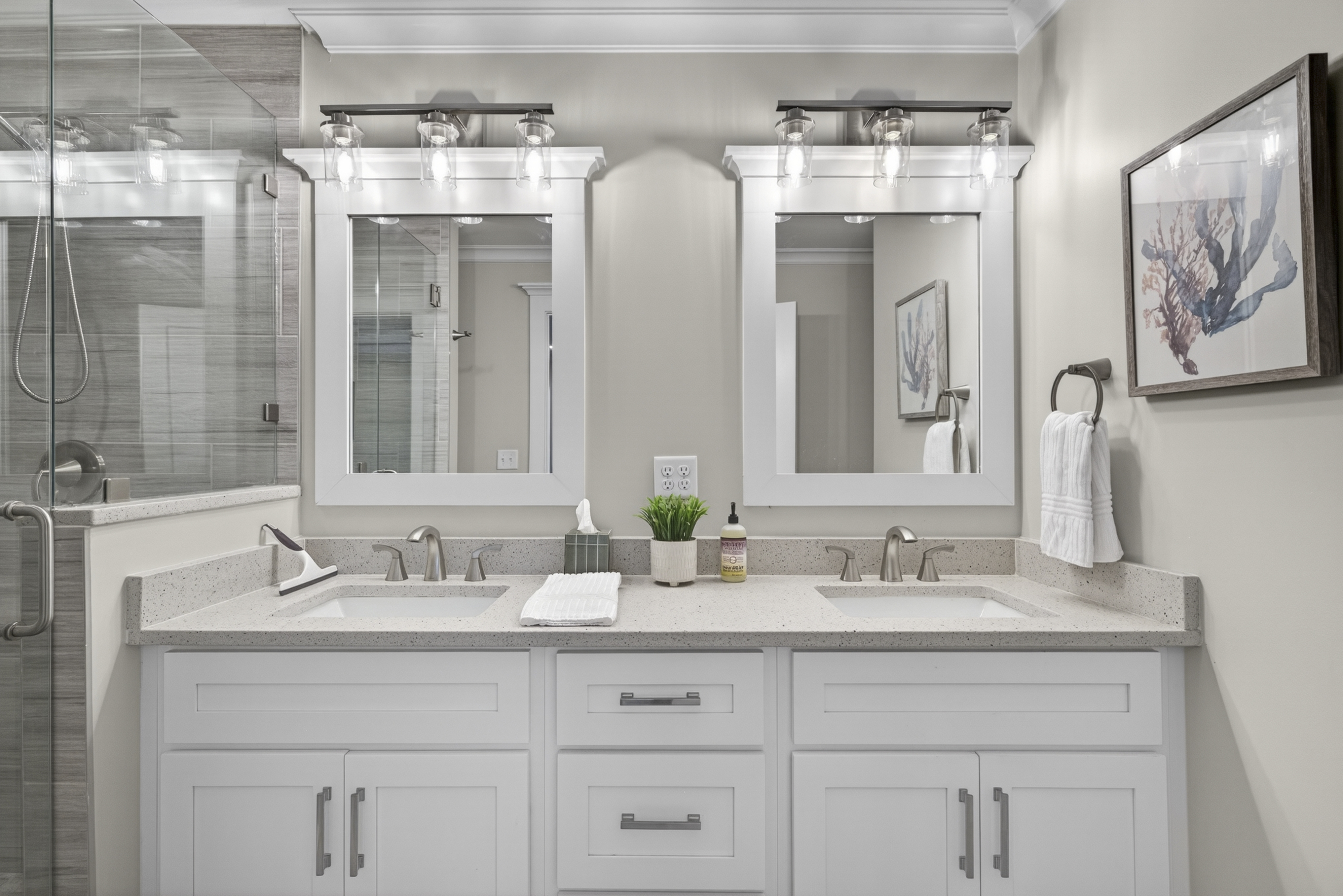 Primary bathroom with double vanity and walk-in shower